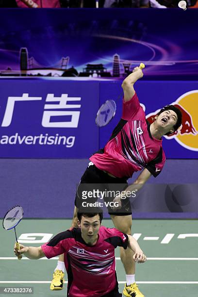 Lee Yong Dae and Yoo Yeon Seong of South Korea compete against Goh V Shem and Tan Wee Kiong of Malaysia during men's doubles quarter-final match on...