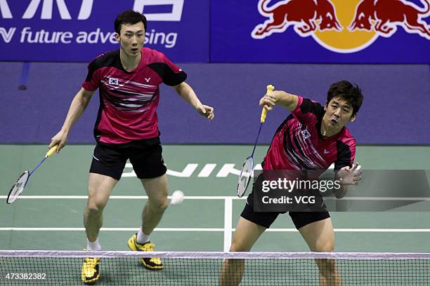 Lee Yong Dae and Yoo Yeon Seong of South Korea compete against Goh V Shem and Tan Wee Kiong of Malaysia during men's doubles quarter-final match on...