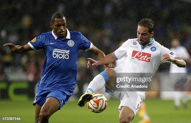 Douglas of Dnipro is in action against Gonzalo Higuain of Napoli during the UEFA Europa League Semi Final second leg match between FC Dnipro...