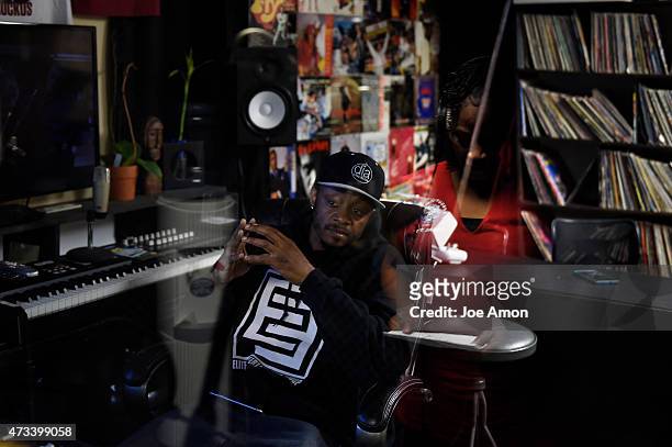 May 14, 2015: Studio owner Xavier Davis listens and watches Denise Hysaw sing while laying down tracks for a video Willie Mosley is recording at dia...