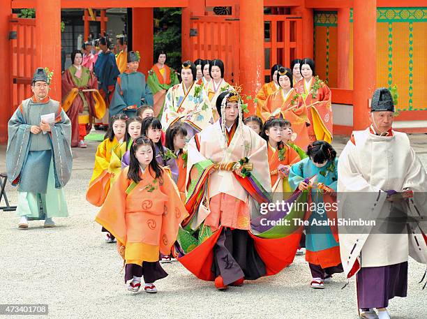 The "Saio-dai" queen wearing "junihitoe," the layered formal kimono of Heian Period court ladies march on during the Aoi Festival at Shimogamo Jinja...