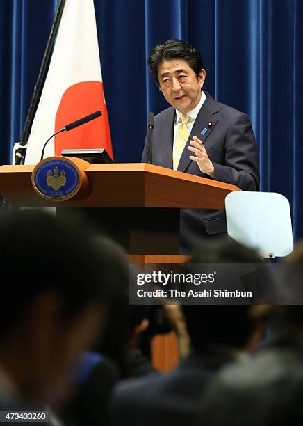 Prime Minister Shinzo Abe explains the "peace and safety legislation" during a press conference at his official residence on May 14, 2015 in Tokyo,...