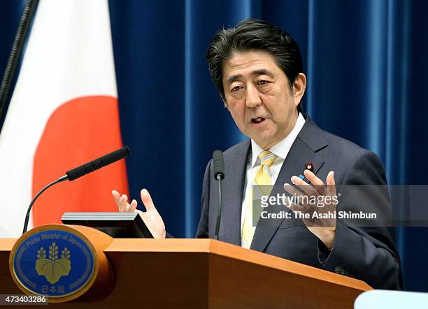 Prime Minister Shinzo Abe explains the "peace and safety legislation" during a press conference at his official residence on May 14, 2015 in Tokyo,...