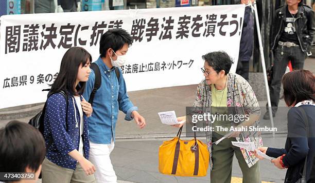 Pro peace constitution protesters demonstrate on May 14, 2015 in Hiroshima, Japan. Abe cabinet approved 11 bills that will expand the overseas role...