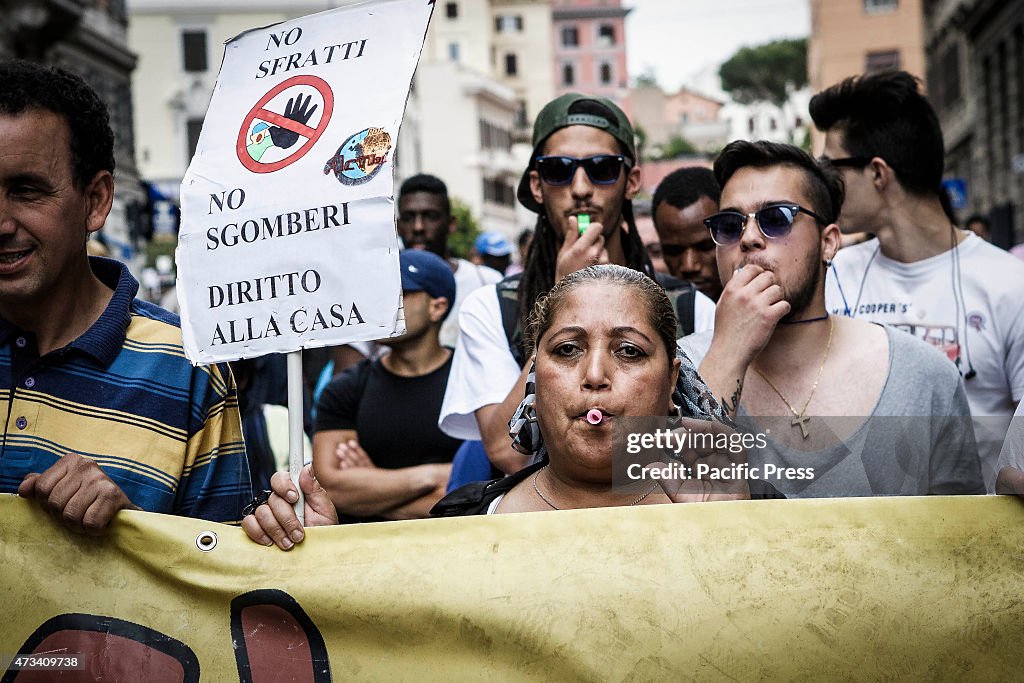 A woman holds a sign reading 'Right to housing'  during a...