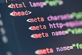 A close-up of HTML coding in bright colors