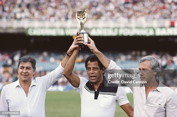 The three Brazil captains who won the Jules Rimet FIFA World Cup hold the trophy, from left to right Mauro Carlos Alberto and Hilderaldo Bellini at...