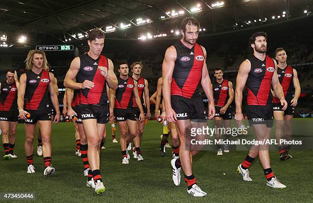 Jobe Watson of the Bombers leads the team off after defeat during the round seven AFL match between the Essendon Bombers and the North Melbourne...