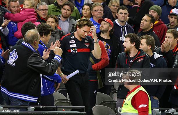 Bombers head coach James Hird walks off after defeat during the round seven AFL match between the Essendon Bombers and the North Melbourne Kangaroos...
