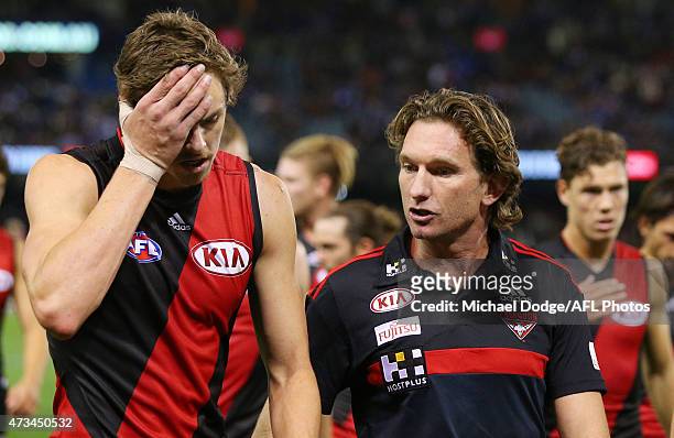 Bombers head coach James Hird speaks to Joe Daniher at half time during the round seven AFL match between the Essendon Bombers and the North...