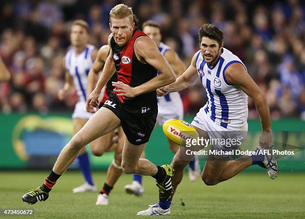 Dustin Fletcher of the Bombers competes for the ball against Jarrad Waite of the Kangaroos during the round seven AFL match between the Essendon...