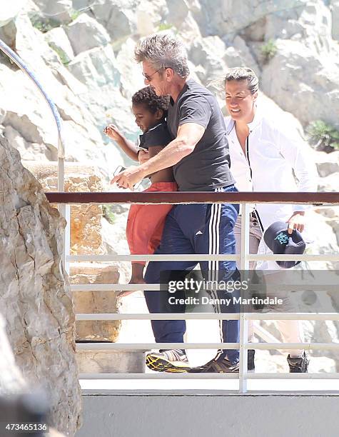 Sean Penn and Jackson Theron are seen at the Hotel du Cap-Eden-Roc day 3 of the 68th annual Cannes Film Festival on May 15, 2015 in Cannes, France.