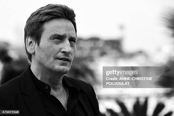 French actor Benoit Magimel poses during a photocall for the film "Standing Tall" ahead of the opening of the 68th Cannes Film Festival in Cannes,...