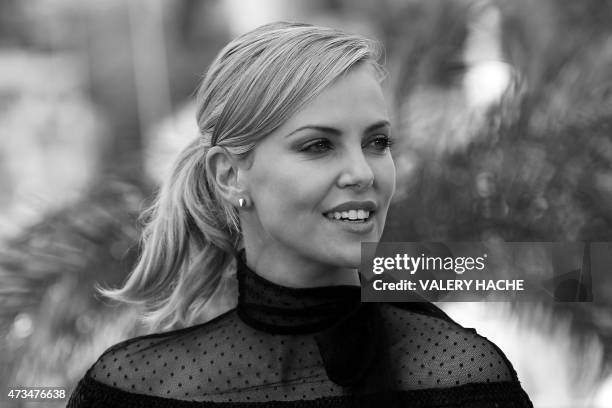 South African-US actress Charlize Theron poses during a photocall for the film "Mad Max : Fury Road" during the 68th Cannes Film Festival in Cannes,...