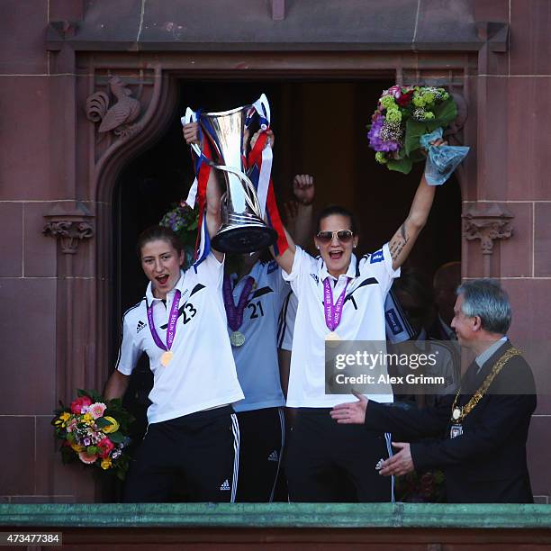 Bianca Schmidt and Desiree Schumann of 1. FFC Frankfurt celebrate their UEFA Women's Champions League victory with Lord Mayor Peter Feldmann on the...