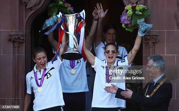 Bianca Schmidt , Desiree Schumann and Kerstin Garefrekes of 1. FFC Frankfurt celebrate their UEFA Women's Champions League victory with Lord Mayor...