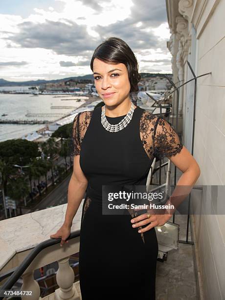 Michelle Rodriguez poses on the balcony of The Avakian Suite during The 68th Annual Cannes Film Festival at The Carlton on May 15, 2015 in Cannes,...