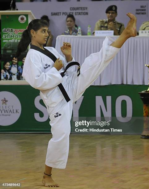 Girl showing her martial arts skills during the launch of the Girls Safety Campaign "Say No To Fear" organized by Delhi Police at Thiagraj Stadium on...