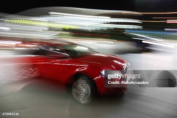 red audi in motion drive fast - fast furious stock pictures, royalty-free photos & images