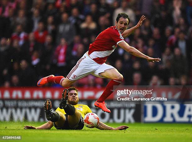 Harlee Dean of Brentford tackles Enrique Garcia Kike of Middlesbrough during the Sky Bet Championship Playoff semi final second leg match between...