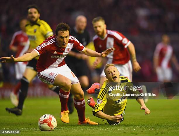 Alex Pritchard of Brentford is challenged by Dean Whitehead of Middlesbrough during the Sky Bet Championship Playoff semi final second leg match...