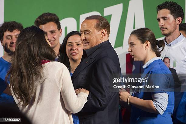 Leader of Forza Italia party Silvio Berlusconi greets supporters after speaking at a meeting to promote Adriana Poli Bortone candidate for the next...