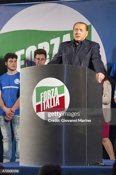 Leader of Forza Italia party Silvio Berlusconi speaks during a meeting as he promotes Adriana Poli Bortone candidate for the next regional elections...
