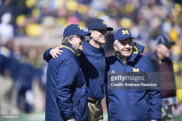 Michigan head coach Jim Harbaugh posing with former head coaches Lloyd Carr and Gary Moeller before spring game at Michigan Stadium. Ann Arbor, MI...