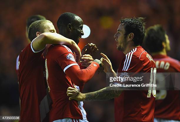 Albert Adomah of Middlesbrough celebrates with Grant Leadbitter and Lee Tomlin as he scores their third goal during the Sky Bet Championship Playoff...