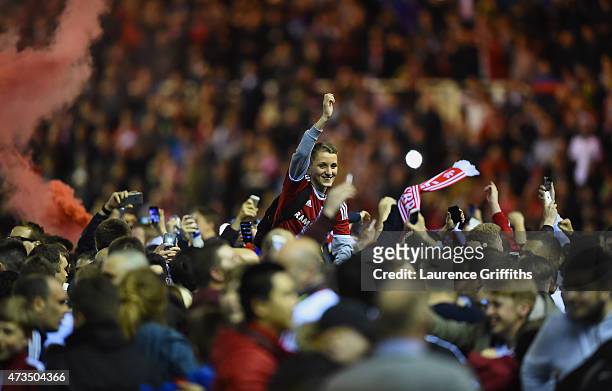 Middlesbrough fans celebrate on the pitch as they reach the final after the Sky Bet Championship Playoff semi final second leg match between...
