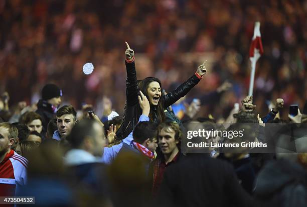 Middlesbrough fans celebrate on the pitch as they reach the final after the Sky Bet Championship Playoff semi final second leg match between...