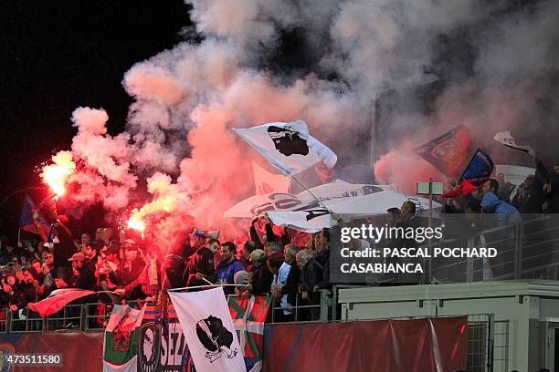 Ajaccio's supporters celebrate after their team won the French L2 football match between GFC Ajaccio and Niort and accessing to the French L1 next...