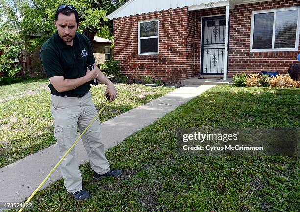 What do you do with a yard that is overrun with dandelions? Marko Mackovic owner of Highlands Landscaping measures the front lawn as he talks about...