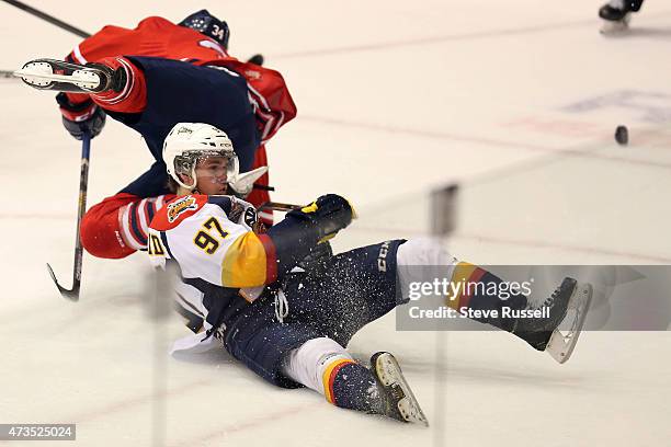 Connor McDavid falls to the ice after a collision with Hunter Smith as the Oshawa Generals play the Erie Otters in what may be Connor McDavid's, the...