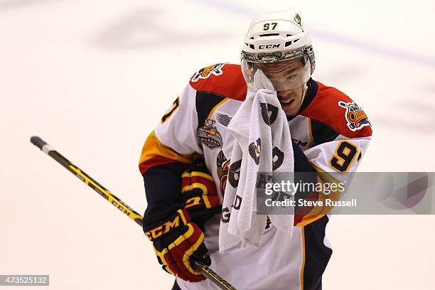 Connor McDavid wipes his visor during a break in play as the Oshawa Generals play the Erie Otters in what may be Connor McDavid's, the top NHL...