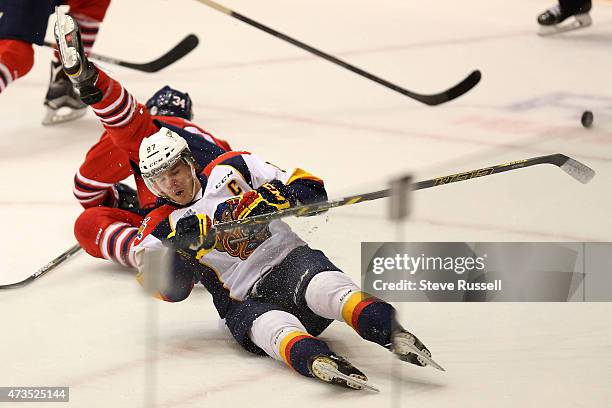 Connor McDavid falls to the ice after a collision with Hunter Smith as the Oshawa Generals play the Erie Otters in what may be Connor McDavid's, the...