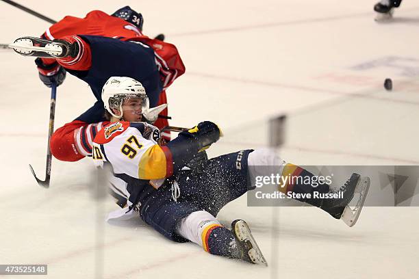 Connor McDavid falls to the ice after a collision with Hunter Smith as the Oshawa Generals play the Erie Otters in what may be Connor McDavid's, the...