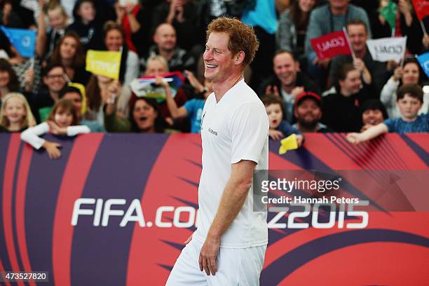 Prince Harry celebrates after scoring the winning goal on the final buzzer as he captains the New Zealand team playing the All Stars in a five a side...