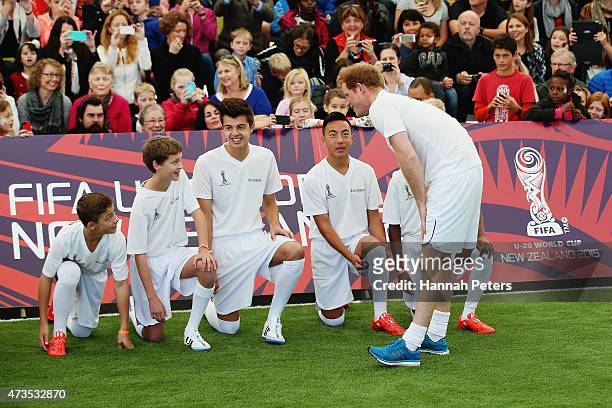 Prince Harry talks to his team as he captains the New Zealand team playing the All Stars in a five a side game of football to promote FIFA Under 20...