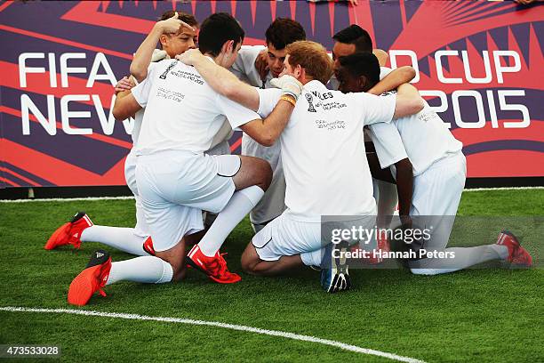 Prince Harry talks to his team as he captains the New Zealand team playing the All Stars in a five a side game of football to promote FIFA Under 20...