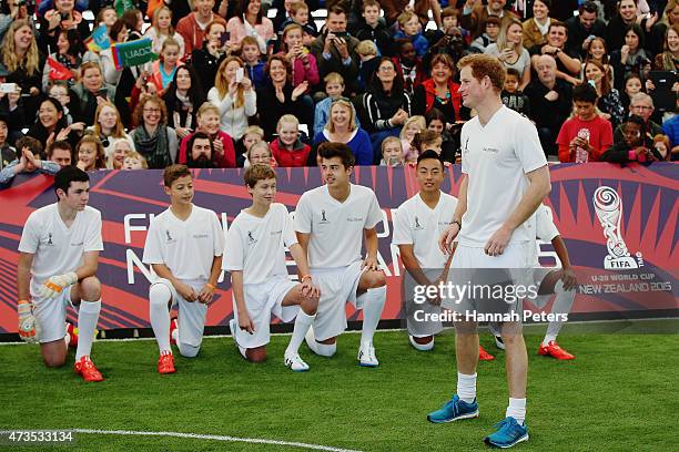 Prince Harry talks to his team as he captains the New Zealand team playing the All Stars in a five a side game of football to promote FIFA Under 20...