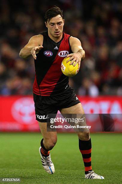 Michael Hibberd of the Bombers kicks during the round seven AFL match between the Essendon Bombers and the North Melbourne Kangaroos at Etihad...