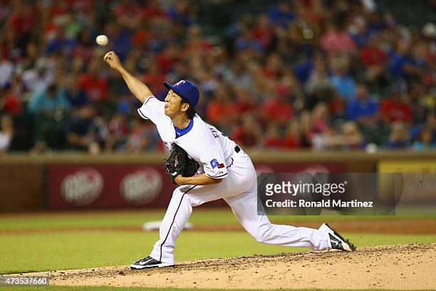 Kyuji Fujikawa of the Texas Rangers throws against the Cleveland Indians in the fifth inning at Globe Life Park in Arlington on May 15, 2015 in...