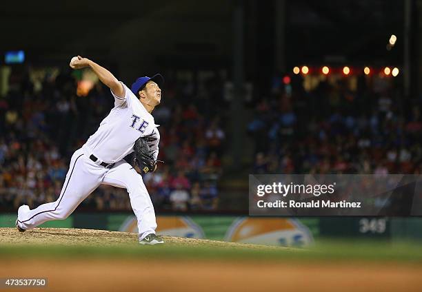 Kyuji Fujikawa of the Texas Rangers throws against the Cleveland Indians in the sixth inning at Globe Life Park in Arlington on May 15, 2015 in...