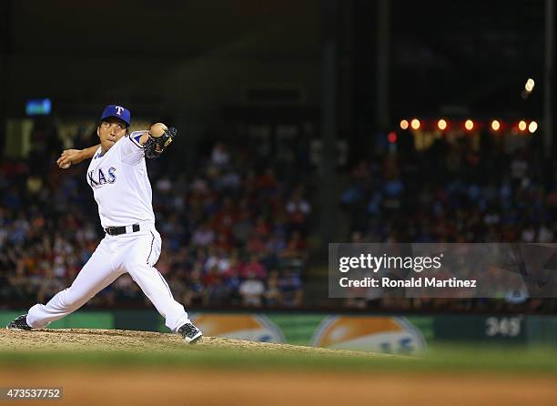 Kyuji Fujikawa of the Texas Rangers throws against the Cleveland Indians in the sixth inning at Globe Life Park in Arlington on May 15, 2015 in...