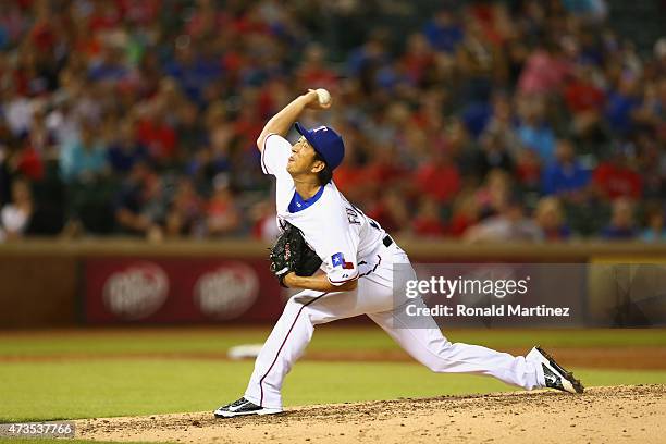 Kyuji Fujikawa of the Texas Rangers throws against the Cleveland Indians in the fifth inning at Globe Life Park in Arlington on May 15, 2015 in...