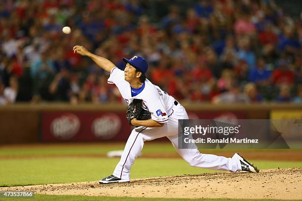 Kyuji Fujikawa of the Texas Rangers throws against the Cleveland Indians in the fifth inning at Globe Life Park in Arlington on May 15, 2015 in...