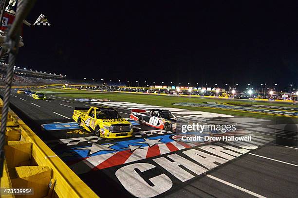 Kasey Kahne, driver of the Haas Automation Chevrolet, takes the checkered flag ahead of Erik Jones, driver of the Dollar General Toyota, to win the...