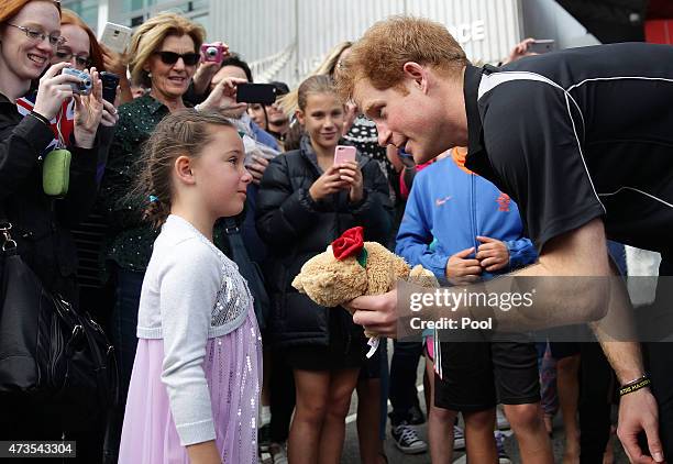 Prince Harry meets a young child at the AUT Millenium Institute on May 16, 2015 in Auckland, New Zealand. Prince Harry is in New Zealand from May 9...
