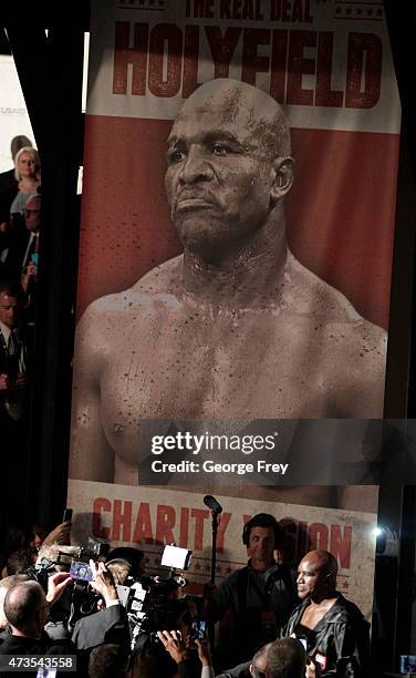 Evander Holyfield enters the arena for his fight against Mitt Romney in a charity boxing event on May 15, 2015 in Salt Lake City, Utah. The event was...